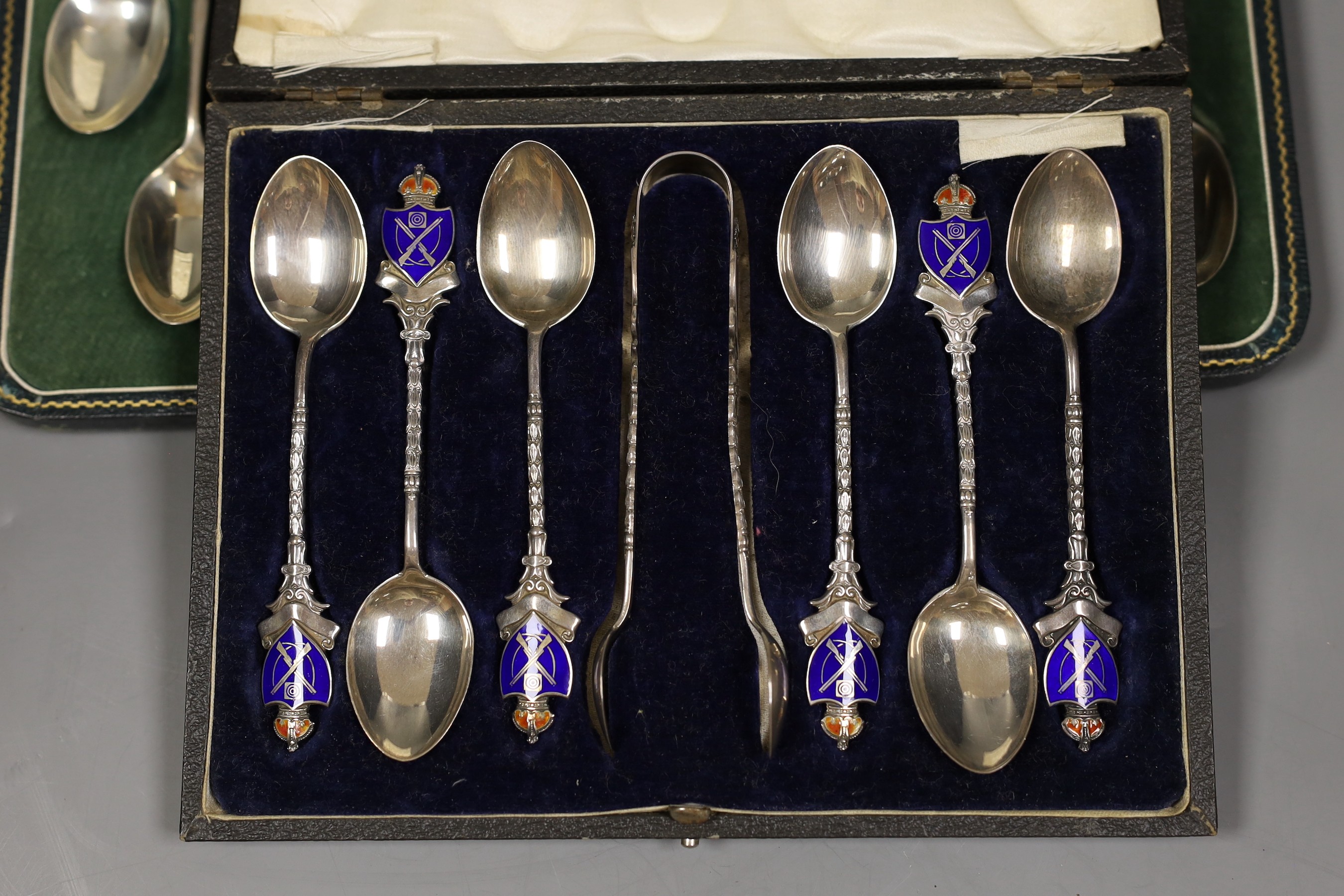 Rifle trophies: a cased set of twelve spoons, two cased sets of silver spoons and a cased set of six plated spoons